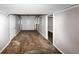 View of the attached garage featuring a white door and neutral-toned walls at 2780 Creekwood Ln, Lawrenceville, GA 30044