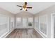 Sunroom with hardwood floors and many windows for natural light at 2780 Creekwood Ln, Lawrenceville, GA 30044