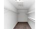 Walk-in closet features neutral walls, carpet and wire shelving at 2780 Creekwood Ln, Lawrenceville, GA 30044