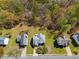 Aerial view of multiple homes surrounded by lush trees at 4542 White Rd, Douglasville, GA 30135