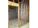 Unfinished basement space with exposed pipes, stud walls, and a concrete foundation ready for renovation at 4542 White Rd, Douglasville, GA 30135