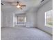 Expansive bedroom has vaulted ceilings, plush carpeting, and plenty of natural light at 4542 White Rd, Douglasville, GA 30135