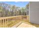 New wooden deck with a view of surrounding trees at 4542 White Rd, Douglasville, GA 30135