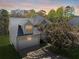 Charming two-story home featuring an attached garage, gray siding, and a lush, flowering tree in the front yard at 4542 White Rd, Douglasville, GA 30135