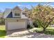 Inviting two-story home with an attached garage and lush front yard, offering both curb appeal and convenience at 4542 White Rd, Douglasville, GA 30135