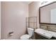 Well-lit half bathroom with modern fixtures and a stone-look backsplash at 4542 White Rd, Douglasville, GA 30135