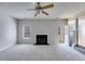 Spacious living room features neutral carpeting and a fireplace at 4542 White Rd, Douglasville, GA 30135