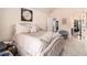 Comfortable bedroom with a plush bed, carpet, and art provides a restful retreat at 817 Nevis Way, Mcdonough, GA 30253