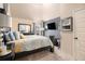 Bedroom featuring a TV and calming color scheme, creating a peaceful space at 817 Nevis Way, Mcdonough, GA 30253