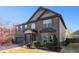 Beautiful two-story house featuring a brick facade, complemented by lush greenery and a well-maintained lawn at 817 Nevis Way, Mcdonough, GA 30253