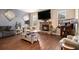 Spacious living room with fireplace, hardwood floors, and stylish furniture at 817 Nevis Way, Mcdonough, GA 30253