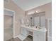 Well-lit bathroom with double vanity, large mirror, and modern fixtures at 2983 Bancroft Nw Gln, Kennesaw, GA 30144