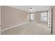 Neutral bedroom with carpet flooring and two windows providing natural light at 2983 Bancroft Nw Gln, Kennesaw, GA 30144