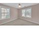 Bedroom featuring carpeted floor and windows at 2983 Bancroft Nw Gln, Kennesaw, GA 30144