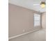 Light-filled room with carpeted floors, fan, and windows at 2983 Bancroft Nw Gln, Kennesaw, GA 30144