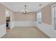 Dining room with modern lighting fixture and view of the kitchen at 2983 Bancroft Nw Gln, Kennesaw, GA 30144