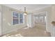 Cozy dining room with large windows and access to sunroom at 2983 Bancroft Nw Gln, Kennesaw, GA 30144