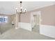 Bright dining room with chair-rail and view of kitchen through doorway at 2983 Bancroft Nw Gln, Kennesaw, GA 30144