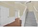 Bright foyer featuring hardwood floors, staircase, and a crisp white trim at 2983 Bancroft Nw Gln, Kennesaw, GA 30144