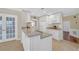 Bright kitchen with granite countertops and an island with a sink at 2983 Bancroft Nw Gln, Kennesaw, GA 30144