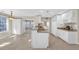 Eat-in kitchen with white cabinets and granite countertops connects to the breakfast nook and sunroom at 2983 Bancroft Nw Gln, Kennesaw, GA 30144