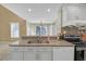 Kitchen island with stainless steel sink and granite countertops at 2983 Bancroft Nw Gln, Kennesaw, GA 30144
