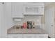 Kitchen counter with granite countertops and a microwave at 2983 Bancroft Nw Gln, Kennesaw, GA 30144