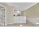 Functional kitchenette area with white cabinets, granite countertops, and tiled flooring at 2983 Bancroft Nw Gln, Kennesaw, GA 30144