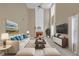 This living room has a fireplace with tall ceilings and windows that bring in natural lighting at 2983 Bancroft Nw Gln, Kennesaw, GA 30144