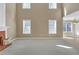 Spacious living room with fireplace, carpet flooring and lots of natural light at 2983 Bancroft Nw Gln, Kennesaw, GA 30144