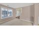 Bright and airy living room with large windows and neutral decor leading to the front entrance at 2983 Bancroft Nw Gln, Kennesaw, GA 30144