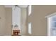 Bright living room with tall ceilings, a brick fireplace and large windows at 2983 Bancroft Nw Gln, Kennesaw, GA 30144