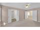 Large primary bedroom with open doorways and a view of the bathroom and additional spaces at 2983 Bancroft Nw Gln, Kennesaw, GA 30144