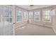 Bright sun room with multiple windows offering natural light and outdoor views at 2983 Bancroft Nw Gln, Kennesaw, GA 30144