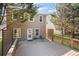 Exterior view of a home with a spacious back deck and a fenced-in backyard, ideal for outdoor living at 313 Hidden Creek Lane, Canton, GA 30114