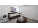 Comfortable bedroom setup with a daybed, coffee table, and a climate control fan at 313 Hidden Creek Lane, Canton, GA 30114