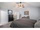 Neutral bedroom with a ceiling fan, soft carpet, and comfortable furnishings at 313 Hidden Creek Lane, Canton, GA 30114