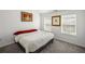 Bright bedroom with two windows, neutral carpet, and an inviting bed at 313 Hidden Creek Lane, Canton, GA 30114