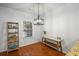 Breakfast nook with hardwood floors, table, shelving unit, and a window with natural light at 313 Hidden Creek Lane, Canton, GA 30114