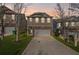 Charming two-story home featuring stone accents, a two-car garage at dusk at 313 Hidden Creek Lane, Canton, GA 30114