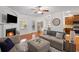 Cozy living room with a fireplace, hardwood floors, and stylish furnishings at 313 Hidden Creek Lane, Canton, GA 30114