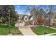 Lovely two-story home with manicured lawn, basketball hoop, and mature trees providing shade and character at 5489 White Cedar Ter, Sugar Hill, GA 30518