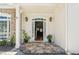 Inviting front entrance with stone detailing and manicured landscaping leading to a charming home at 5489 White Cedar Ter, Sugar Hill, GA 30518