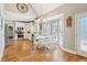 This open eat-in kitchen features stainless steel appliances, hardwood floors, and ample natural light at 5489 White Cedar Ter, Sugar Hill, GA 30518