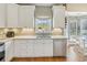 Bright eat-in kitchen with stainless steel appliances and a large window at 5489 White Cedar Ter, Sugar Hill, GA 30518