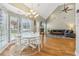 Bright living room with hardwood floors, vaulted ceiling, and a cozy fireplace at 5489 White Cedar Ter, Sugar Hill, GA 30518