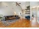 Comfortable living room with hardwood floors, high ceilings, and view to other rooms in the home at 5489 White Cedar Ter, Sugar Hill, GA 30518