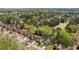 Wide aerial view of a neighborhood with mature trees and golf course views at 6317 Southland Forest Dr, Stone Mountain, GA 30087