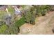 Aerial view of a residential area bordering a golf course; surrounded by mature trees at 6317 Southland Forest Dr, Stone Mountain, GA 30087