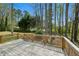 A natural wooden deck with scenic backyard views surrounded by trees and nature at 6317 Southland Forest Dr, Stone Mountain, GA 30087